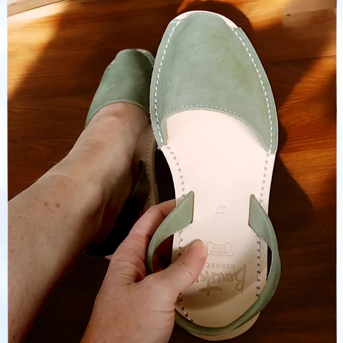 holding-green-avarca-sandal